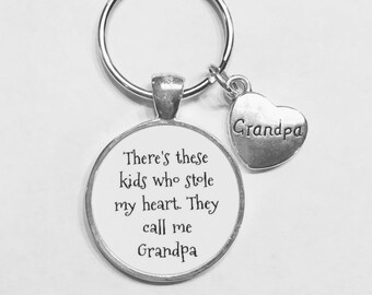 May include: Silver keychain with a round charm that says "There's these kids who stole my heart. They call me Grandpa." and a small heart charm that says "Grandpa".