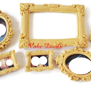 May include: Set of six gold-colored picture frames with ornate designs. The frames are various sizes and shapes, including oval, rectangular, and square.