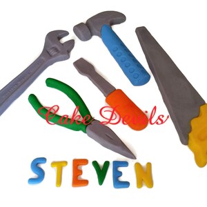 May include: A set of five colorful toy tools, including a hammer, wrench, pliers, screwdriver, and saw, with the name "STEVEN" spelled out in colorful letters.