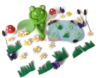 Fondant Frog Pond Cake Topper with Lily Pads, Rocks, Mushrooms, Butterflies, Flower and more Cake Decorations, Frog sitting on edge of cake