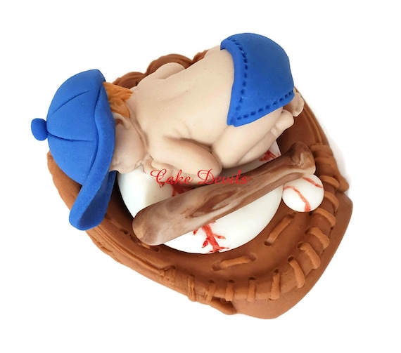 baby in baseball glove