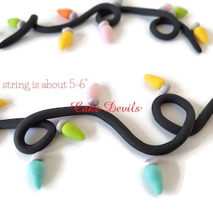 May include: A string of colorful lights, each light is about 1.3 cm long, with a black wire. The string is about 13-15 cm long. "Each string is about 5-6" "