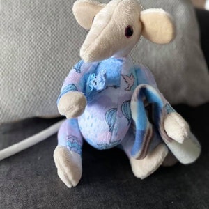 Plush rat in a onesie