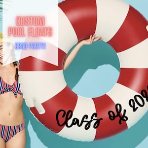 May include: A red and white striped pool float with the text "Class of 2021" in black script. The float is round with a hole in the center. The words "Custom Pool Floats" and "Grad Party!" are also visible.