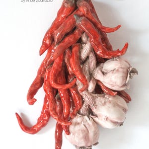 Ceramic sculpture of garlic and chilli peppers