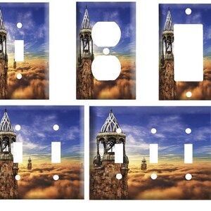 May include: A set of light switch and outlet covers featuring a fantasy-themed image of a stone tower rising above a sea of clouds. The tower has a pointed roof and arched windows. The sky is a vibrant blue with a hint of orange at the horizon. The clouds are a soft, fluffy white.