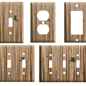 May include: Set of five light switch and outlet covers featuring a bamboo pattern. The covers are in various sizes and configurations, including single switch, double switch, and outlet.