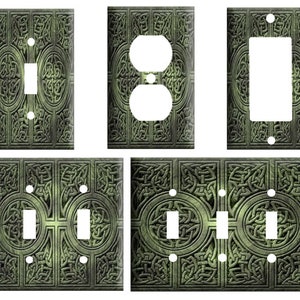 May include: Set of four decorative light switch and outlet covers featuring a Celtic knot design in shades of green and brown.