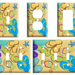May include: A set of three light switch and outlet covers featuring a beach scene with flip flops, seashells, and starfish. The covers are available in single, double, and triple switch configurations.