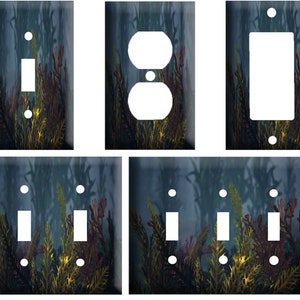 May include: Set of five light switch and outlet covers featuring a blue and green underwater scene with yellow seaweed. The covers are available in single, double, and triple switch configurations.