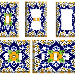 May include: Set of five decorative light switch covers featuring a colorful Mexican tile pattern in shades of blue, yellow, white, and green. The designs include a single switch, a double switch, and a standard outlet.