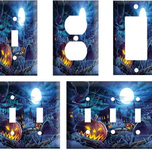 May include: A set of four Halloween-themed light switch covers. The covers feature a spooky nighttime scene with a full moon, trees, and jack-o'-lanterns. The switch covers are available in a variety of sizes to fit standard light switches.
