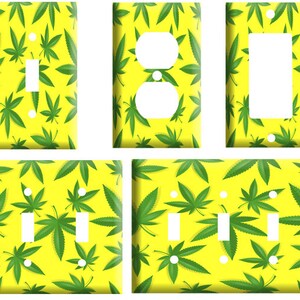 May include: Set of five light switch and outlet covers featuring a green marijuana leaf pattern on a yellow background.