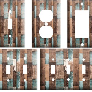 May include: Set of six light switch and outlet covers featuring a rustic wood plank design with blue and brown tones.