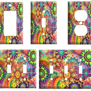 May include: A set of colorful light switch and outlet covers featuring a psychedelic pattern of swirling flowers and geometric shapes in shades of pink, purple, orange, yellow, green, and blue.