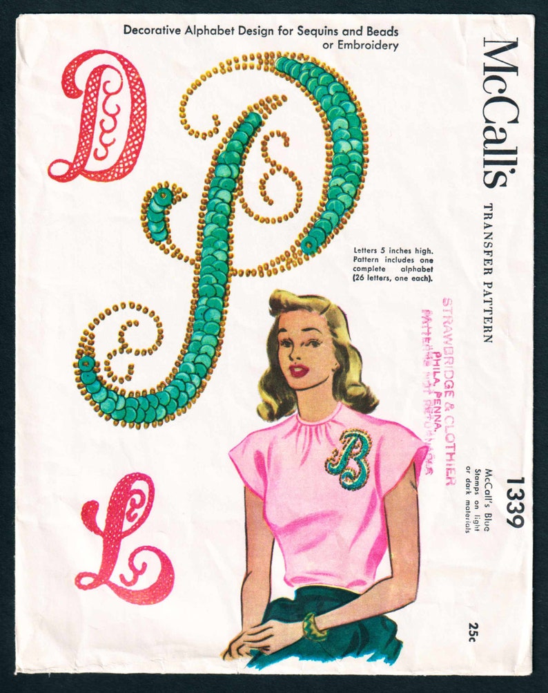 May include: Vintage McCall's transfer pattern featuring decorative alphabet designs for sequins and beads. The letters are 5 inches high. The image includes a woman wearing a pink top with a sequined letter "B".