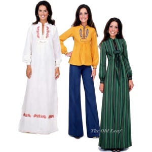 May include: Three vintage outfits: a white embroidered dress, a mustard yellow blouse with navy blue pants, and a green striped dress. The white dress has floral embroidery and the word "Marika". The green dress has a black bow. The Old Leaf is written on the bottom right.