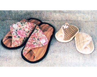 May include: A collection of handmade slippers in various styles. Two pairs of open-toe slippers feature a floral print on the top, with a button detail. The other two pairs are closed-toe slippers with a plaid and patterned design. All have a striped base.