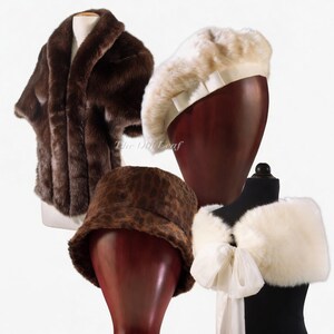 May include: An assortment of vintage-style faux fur accessories. Includes a brown fur cape, a cream-colored beret with a white ribbon, a leopard print bucket hat, and a white fur wrap with a bow.
