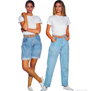 May include: Two women wearing white t-shirts, light blue denim shorts and jeans, brown belts, and white sneakers. The image is a vintage fashion shot.