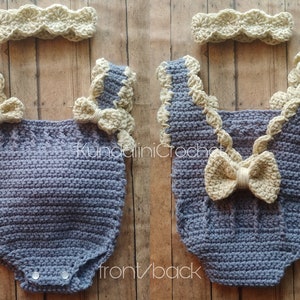 May include: A crocheted baby outfit in a light blue color with a matching headband. The outfit has a scalloped trim and a bow on the back. The headband is a simple band with a scalloped edge.