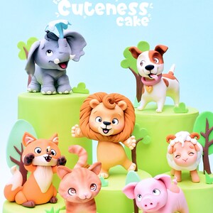 May include: A cake decorated with several animal figurines, including an elephant, dog, lion, fox, cat, pig, and sheep. The cake is green with a light blue background. Text at the top reads "PDF version for Cuteness cake".