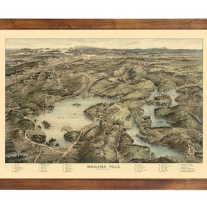 May include: An antique map of Middlesex Fells, Massachusetts, showing the area's lakes and ponds. The map is framed in a brown wooden frame and has a cream-colored background.