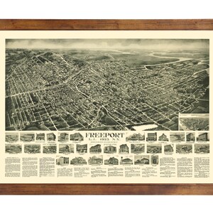 May include: An antique aerial view map of Freeport, Long Island, New York, from 1923. The map shows the town's layout with streets, buildings, and landmarks. The map is framed in a brown wooden frame.