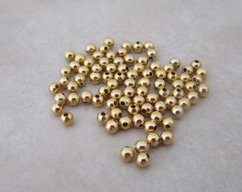 100 small 2.4mm gold plated steel round beads