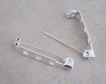24 pin backs 1 inch silver plated