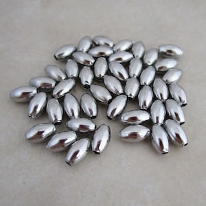 Bolas de arroz huecas de acero inoxidable de 7 mm x 4 mm hipoalergénicas