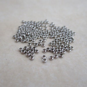 100 stainless steel micro crimp beads 1.4mm wide, 0.8mm hole