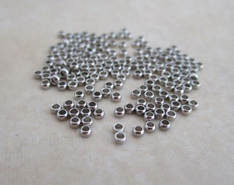 100 stainless steel micro crimp beads 1.4mm wide, 0.8mm hole