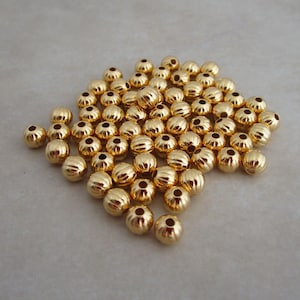 50 corrugated gold plated 5mm round beads
