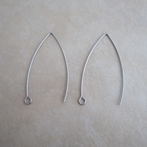May include: Two silver earring hooks with a small loop at the end.