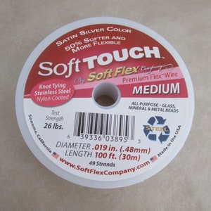May include: A spool of Soft Touch Medium Premium Flex Wire, a satin silver color, 50% softer and more flexible, knot tying stainless steel nylon coated, 26 lbs test strength, 0.019 inches in diameter, 100 feet in length, 49 strands, made in the USA.