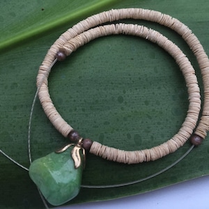 Vintage paper shell lei made with &quot;paper shells&quot; from kailua beach also includes a pendant that looks like jade