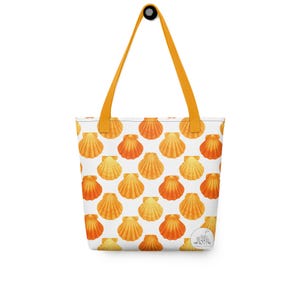 May include: A white tote bag with a repeating pattern of orange and yellow seashells. The bag has orange handles and a small circular logo on the bottom right.