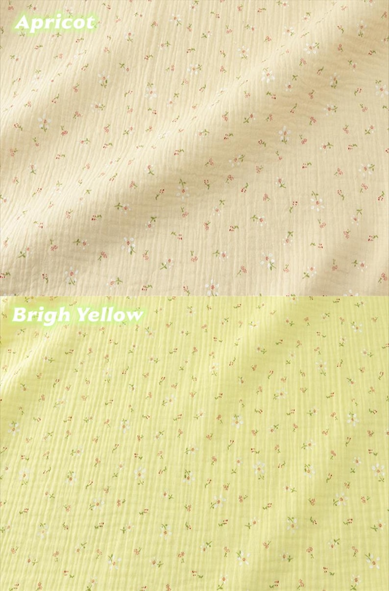 May include: Close-up of two sections of fabric. The top section is apricot-colored and the bottom section is bright yellow. Both fabrics are covered in tiny white and pink floral patterns.