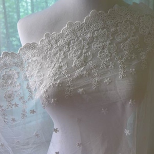 Graceful embroidered floral tulle lace fabric in off white for bridal, dress, cuffs, costume design