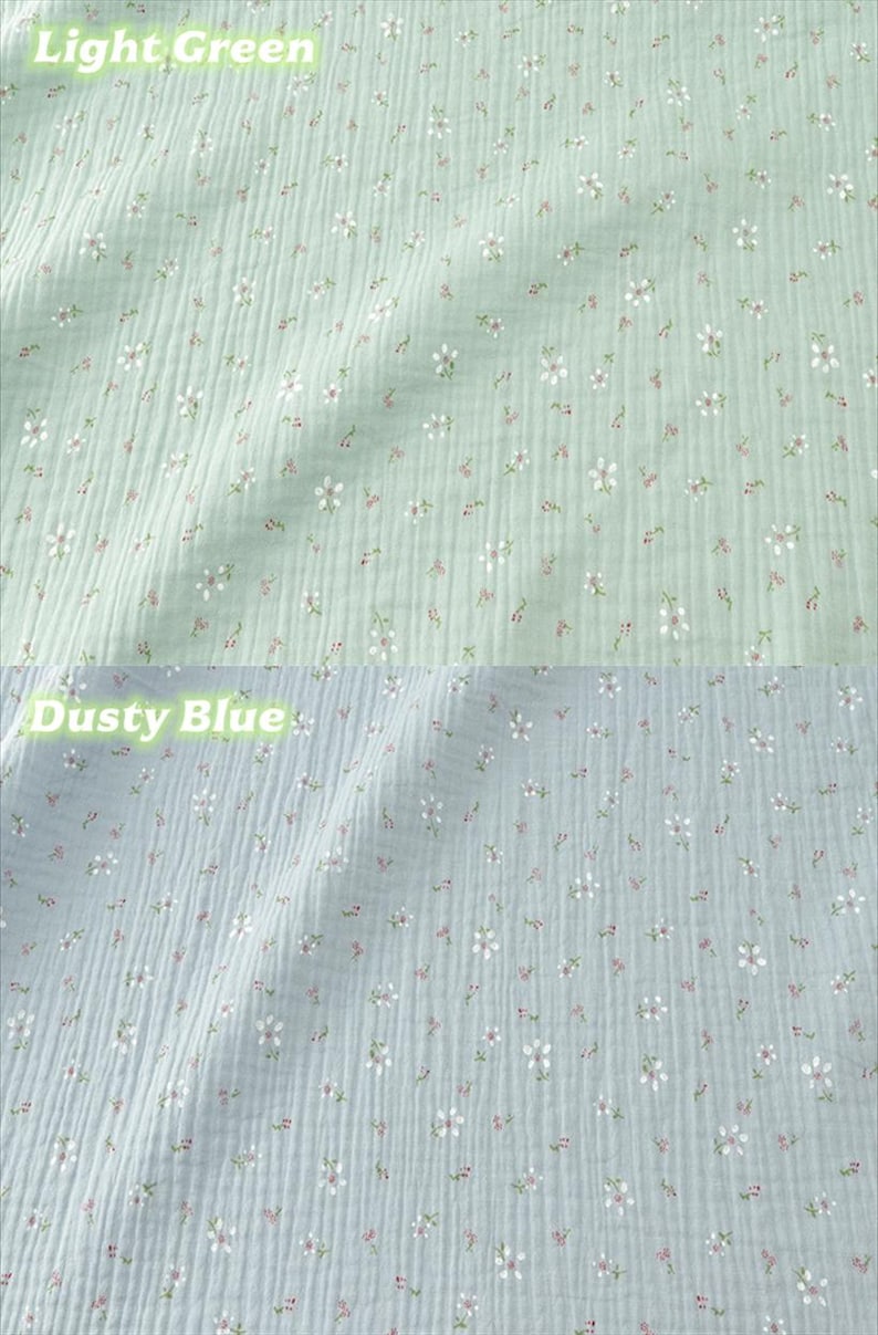 May include: Two sections of fabric, one light green and one dusty blue, are shown. Both fabrics have a crinkled texture and are covered in small white and pink floral patterns. The words "Light Green" and "Dusty Blue" are written above each fabric.