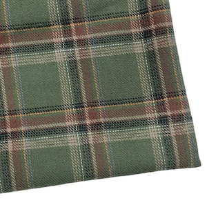 May include: Close-up of a green plaid fabric featuring a pattern of brown, black, white, and yellow lines. The fabric has a textured appearance and a classic design, suitable for various textile applications.
