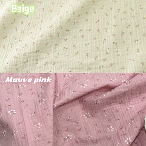 May include: Two sections of fabric, one beige and one mauve pink, both with a floral pattern. The beige fabric has small pink and white flowers scattered across it. The mauve pink fabric has a similar pattern, with white flowers and pink accents.