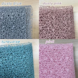 May include: Four samples of mesh fabric in different colors: dusty blue, dusty pink, turquoise, and pink. The fabric has a delicate, open weave.