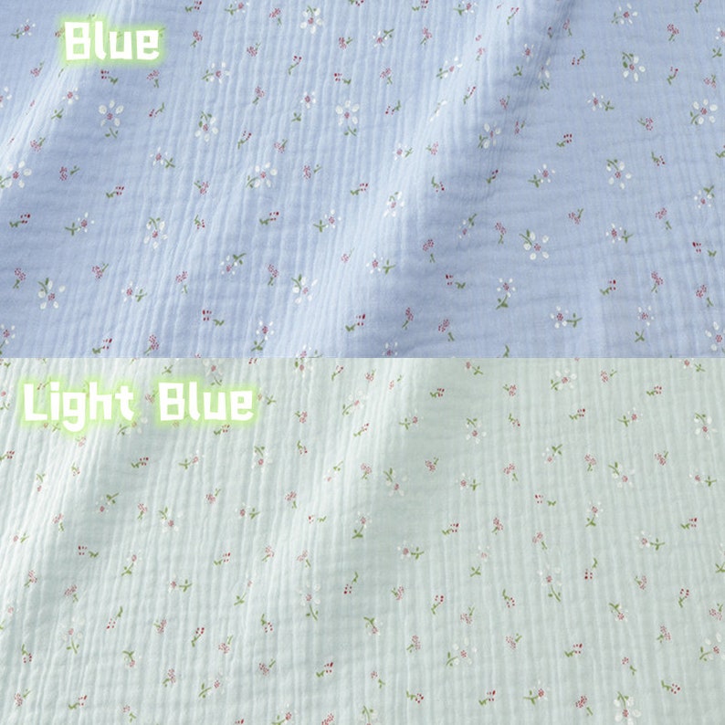 May include: Two sections of fabric, one light blue and one light green, are covered in small white and pink floral patterns. The word "Blue" is written in green text above the light blue fabric, and "Light Blue" is written above the light green fabric.