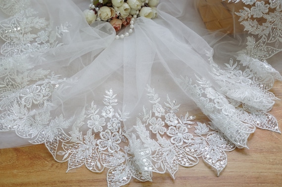 Tulle ricamato shop per abiti