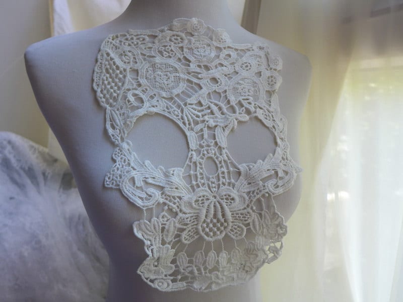 Fluffy long sleeve skull applique hollow out top