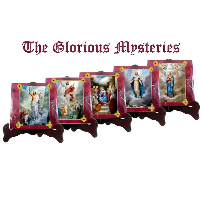 May include: Set of four square ceramic tiles depicting scenes from the Glorious Mysteries of the Rosary. Each tile features a gold frame and is displayed on a wooden easel.