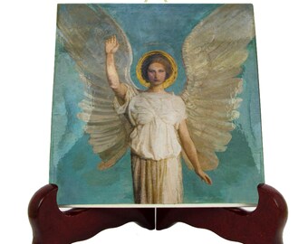 May include: A ceramic tile with a painting of an angel with wings outstretched. The angel is wearing a white robe and has a halo. The background is a blue and green sky.