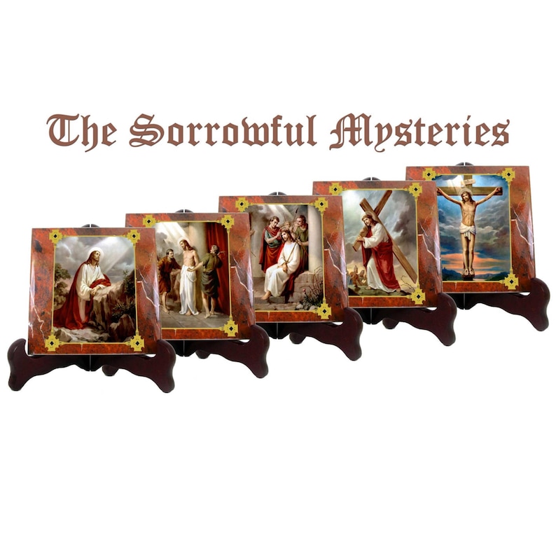 May include: Set of five framed religious art prints depicting scenes from the Sorrowful Mysteries of the Rosary. Each print features a different scene from the life of Jesus Christ, including his agony in the garden, the scourging at the pillar, the crowning with thorns, the carrying of the cross, and the crucifixion.